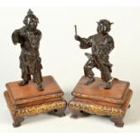 A pair of good Japanese Eisuke Niya'O bronze figures of boy musicians each stands on a gilt