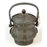 A Chinese 19th century western Chou style bronze basket handled Yu and cover,