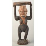 A Papua New Guinea Sepik painted carved figure stool.