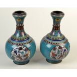 A pair of Chinese bottle shape cloisonne vases, each with waisted neck and garlic rim,