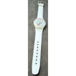 A Maxi Swatch Nikolai Vasily 1980s giant wrist watch on a white plastic strap, length 210cm,