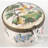 A French fiaence fluted snuff box, the lid painted with a bird in a landscape,