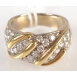 An 18ct. two colour gold contemporary ring pave set with diamonds.