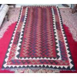 A red ground hand made Persian Kilim carpet, 245 x 155cm.