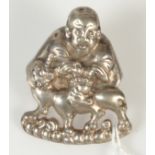 A Chinese silver deity hat finial.