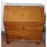 An 18th century oak, slope front bureau.