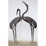 A large pair of Japanese bronze figures of cranes, heights 171cm and 145cm.