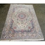 A Nain Isfahan part silk carpet, the ivory ground with a polychrome lobel pole medallion,