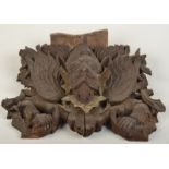 A Thai hardwood panel carved with the god Garuda,