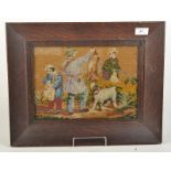 A 19th century relief woolwork panel of huntsman, their dog and gamekeeper in an oak frame, 22.