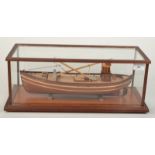 A scale model of a Scottish ring net fishing boat in a glazed display case, length of boat 40cm,