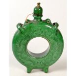 A Hungarian incised, green glaze Sandoz Kantor discus pilgrim flask and cover, height 29cm.