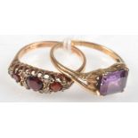 An Art Nouveau style 9ct. gold ring set an amethyst and one other gold ring.