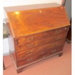 A George III mahogany, slope front bureau of large proportions.