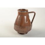 A Doulton Lambeth Silicon ware jug made as if of riveted copper, silver mount London 1894,