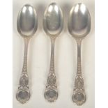 A set of three rare late Victorian ornate table spoons by Holland Aldwinckle and Slater,