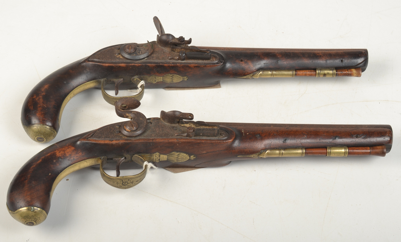 A pair of 18th century flintlock pistols, each signed Carter,