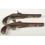 A pair of 18th century flintlock pistols, each signed Carter,