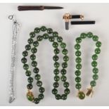 A green hard stone necklace, a matching bracelet etc.