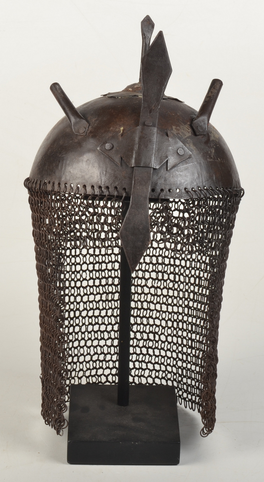 A 20th century Indo Persian Khula Khud helmet with an adjustable nose guard and pair of plume