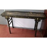 A Chinese mid 19th century, black lacquer alter table, gilt decorated with riverside buildings,