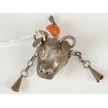 A Chinese silver bulls head hat finial with agate bead and enamel.