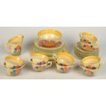 A Clarice Cliff 'Crocus' pattern tea service comprising eight cups and ten saucers, 8cm plates,