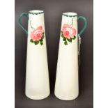 A pair of good Wemyss style tall tapering jugs,