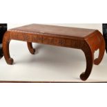 A Chinese carved hardwood Kang table, the sides carved with sailing boats and figures on a path,