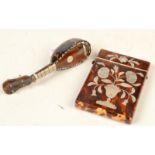 A tortoiseshell and mother of pearl card case and a miniature mandolin.