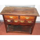 A rare, 18th century oak side table in the form of a low dresser,