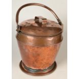 A copper coal bucket and lid.