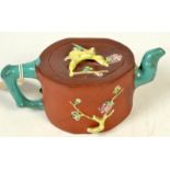 A Chinese Yixing pottery teapot, 19th century, with glazed handle, cover and spout,