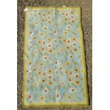 A Greek Needlepoint rug, the pale blue field decorated with flowerheads, vines and leaves,
