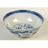 A Chinese blue and white porcelain bowl, decorated with dragons, four character Kangxi mark to base,