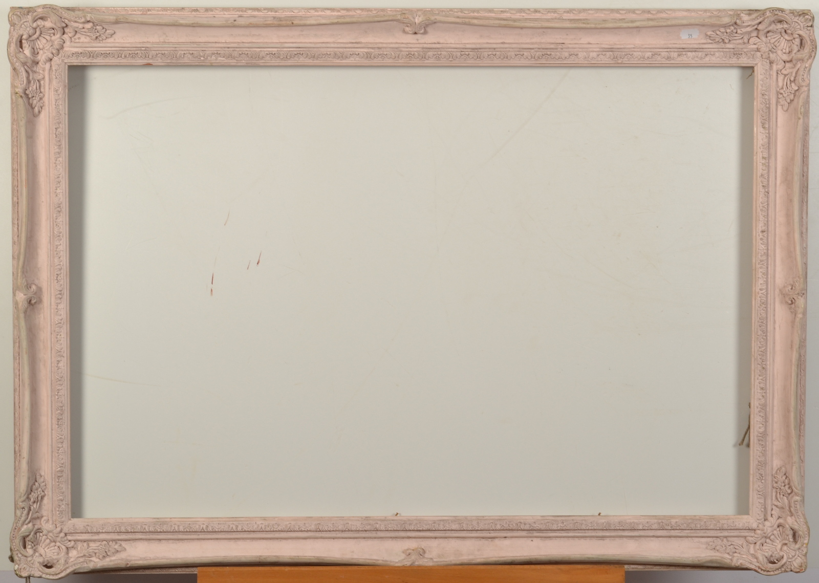 A maple veneered frame 56 x 64cm and one other frame 61 x 91cm