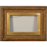 A pair of ornate gilt picture frames with plain gold slip 23 x 39cm