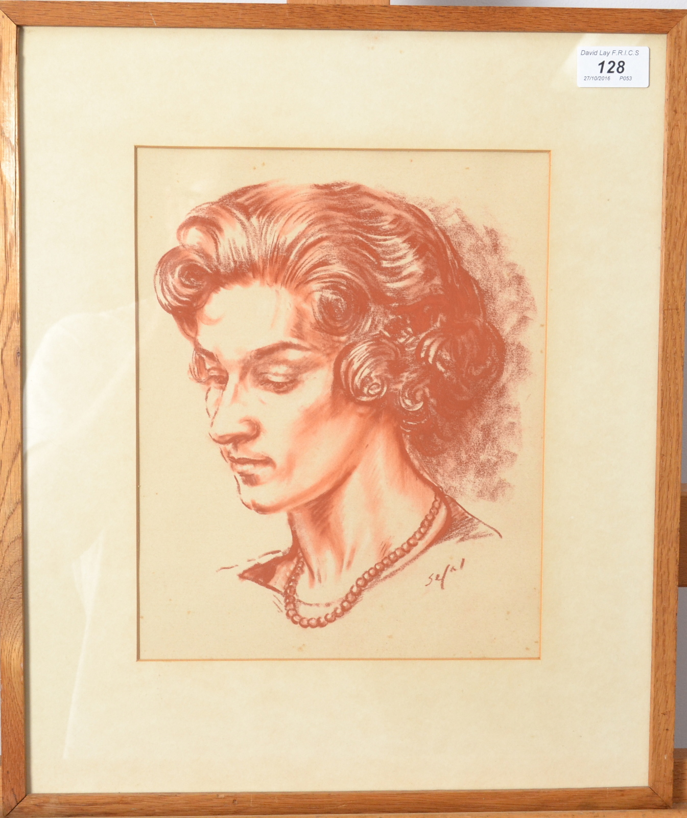 HYMAN SEGAL Portrait of a lady Red chalk Signed 27 x 21.5cm.