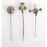 An Arts and Crafts enamelled pin with two flower heads beneath a crown RD No.