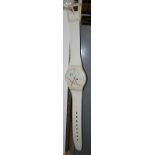 A Maxi Swatch Nikolai Vasily 1980s giant wrist watch on a white plastic strap, length 210cm,