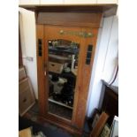 A good Arts and Crafts oak single wardrobe with wide cornice,