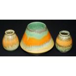 Two Ruskin miniature vases each with mottled green and orange running glazes,