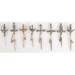 Eight Italian micromosaic sword pins in gilt metals, some silver,