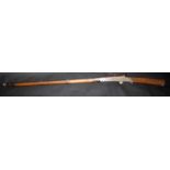 An eastern matchlock musket with flared chased barrel, the stock dated 1935, full length 162.5cm.