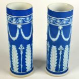 A pair of Wedgwood blue jasper dip cylindrical vases. Height: 25cm. Diameter: 8cm.