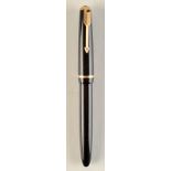 A Parker junior black fountain pen with 14 ct. gold nib.