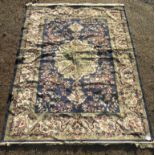 A Tabriz design machine made carpet, the indigo field with a central lobed pole medallion,