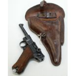 A Luger 9mm Mauser S42 semi automatic pistol dated 1939, various parts numbered 33, code mark 4233,