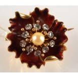 A high purity gold red enamelled flower head brooch with five petals about a central pearl and