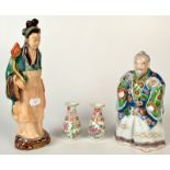 A Japanese famille verte figure of a samurai in crane decorated robes, height 21cm.